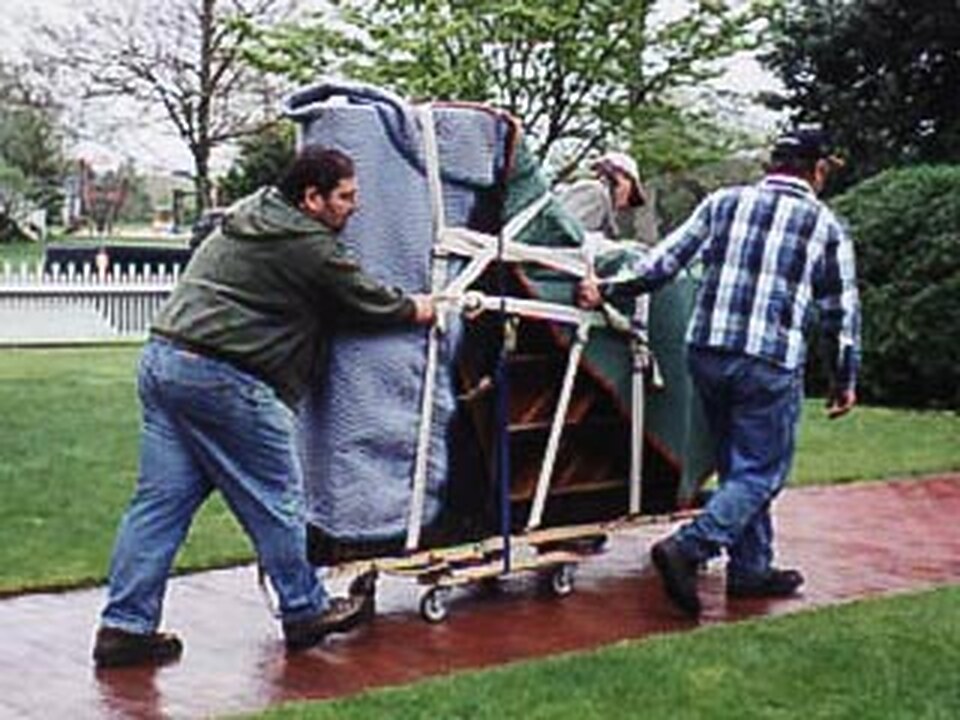 Jimmy Burgoff's crew moving an upright piano